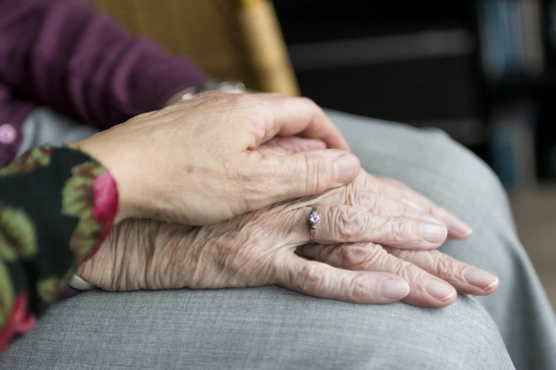 Elderly being comforted due to The Emotional Impact of Wrongful Death Cases on Families