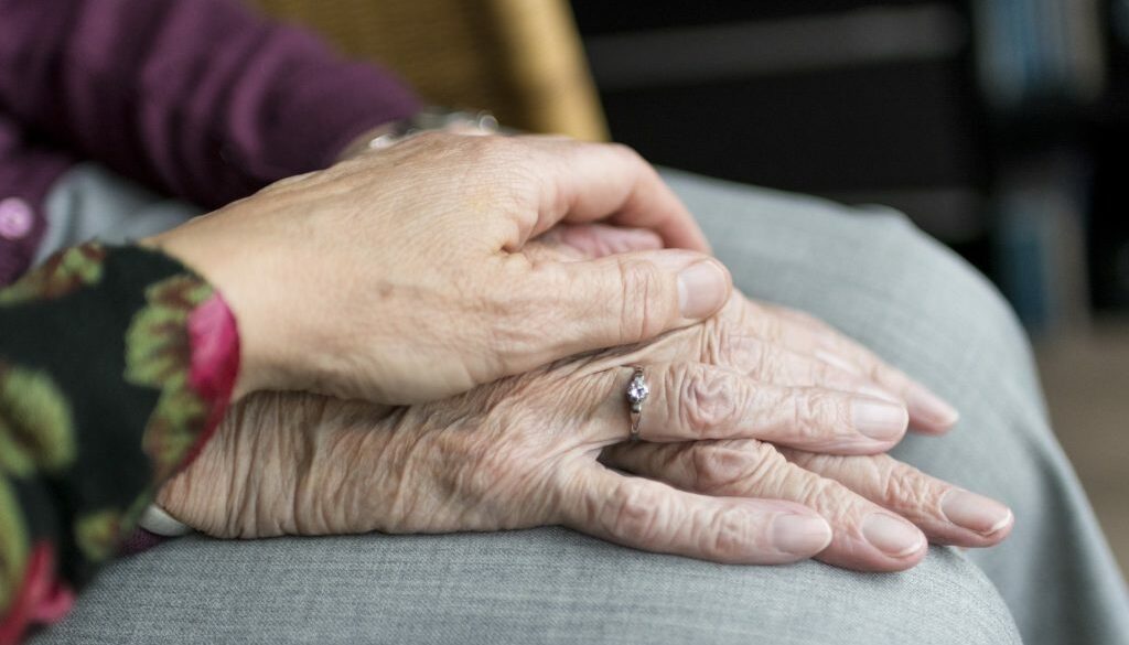 Elderly being comforted due to The Emotional Impact of Wrongful Death Cases on Families