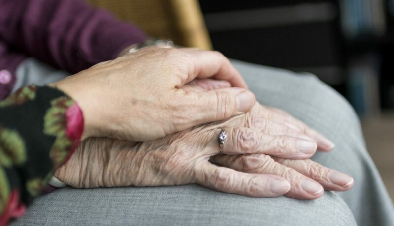 Elderly being comforted due to The Emotional Impact of Wrongful Death Cases on Families